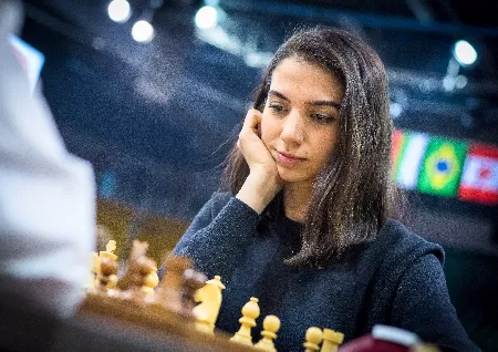 At an international chess match, Sara Khadem of Iran competes uncovered